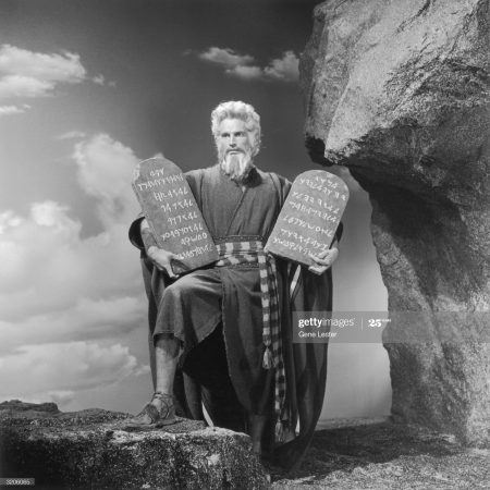 1956:  EXCLUSIVE American actor Charlton Heston as Moses in a still from director Cecil B. DeMille's film, 'The Ten Commandments'. Heston holds two stone tablets carved with the word of God.  (Photo by Gene Lester/Getty Images)